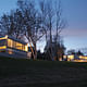 Litchfield Homes - The Huvelle House (near left) and Stillman I (far right): The two houses side by side at dusk, sharing a similar modernist language. Calder mural (far right). Credit: Brad Stein and Joseph Mazzaferro