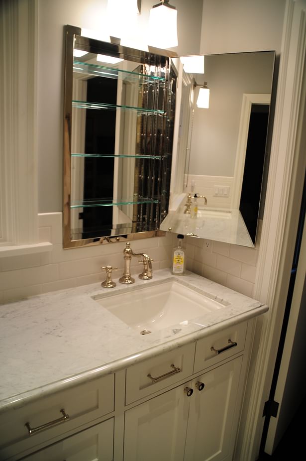 An additional sink with new medicine cabinets created more storage. 