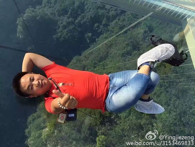 Selfie with a view: tourists were quick to share scarily fun shots on social media. (Image: Weibo, via Mashable)