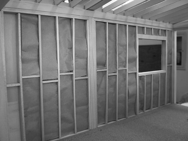 This image shows the insulation and wooden frame construction in the interior. 