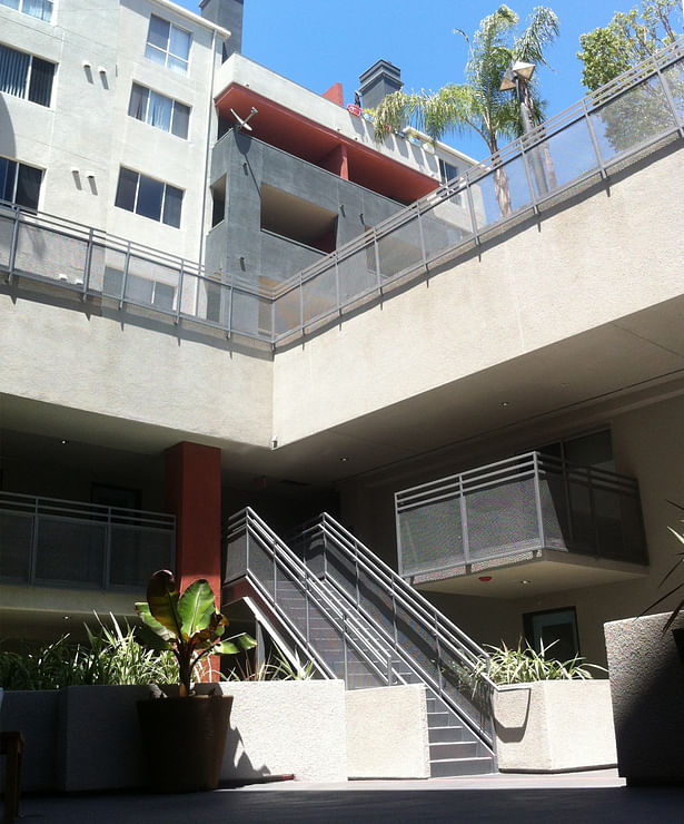 New Courtyards punched open to existing units above, act as the circulation corridors for open sun and ocean-air ventilation.