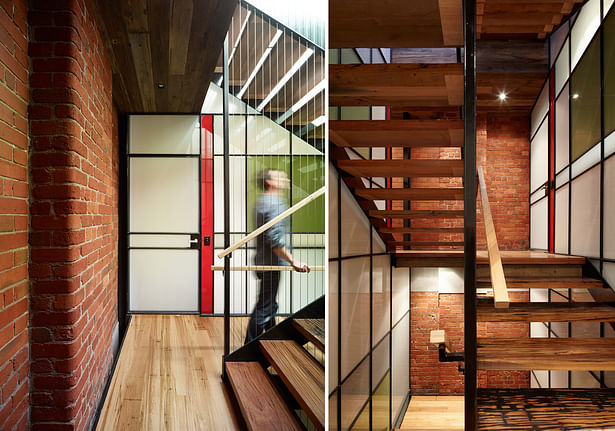 Natural light cascades down the stair atrium, deep into the building. The stair structure was kept as thin as possible to maximise daylight penetration to the lower levels and via the glazed atrium walls. Photo: Peter Bennets The coloured glass panels create further interest. 