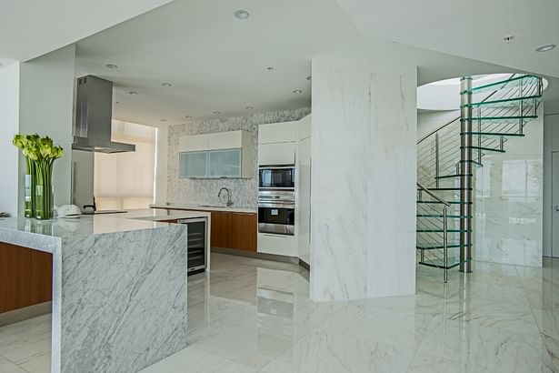 Spiral Staircase Featuring Glass Treads and Stainless Steel Railings.