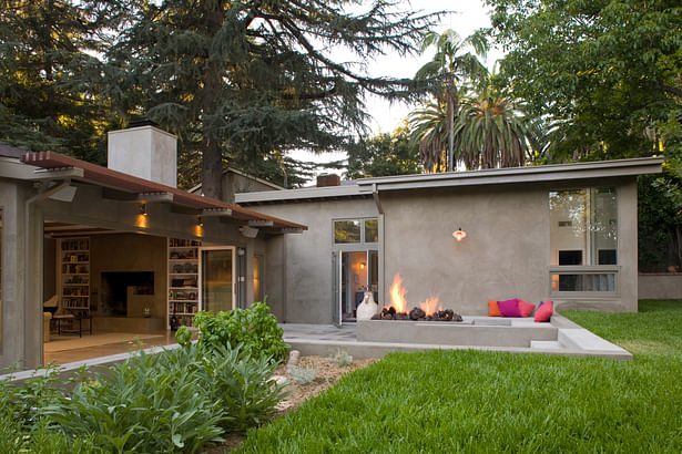 This new configuration doubles the size of the living room as it pours into the outside semi sunken patio.