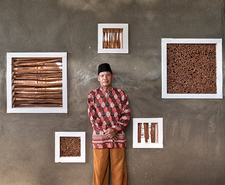 Local farmer in front the showroom wall (Photo: Pasi Aalto / pasiaalto.com)