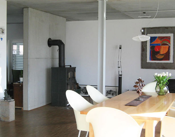 concrete dividing wall between the living room and study