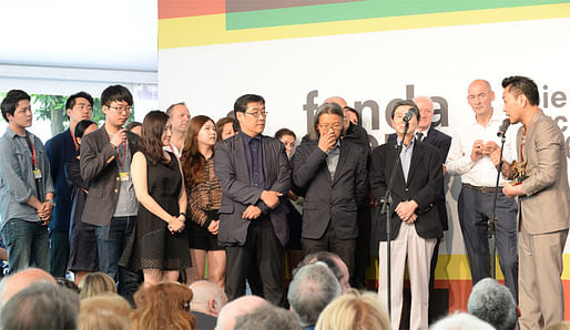 Korean pavilion commissioner Minsuk Cho accepting the Golden Lion award for Best National Participation at the 2014 Venice Biennale awards ceremony. Photo © 14th International Architecture Exhibition