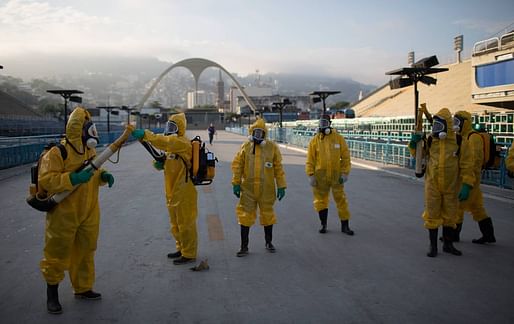  Health workers spray insecticide to combat the mosquitoes that transmit the Zika virus at the Sambadrome in Rio de Janeiro, Brazil, Tuesday, January 26, 2016. (AP Photo / Leo Correa) Image via thenation.com.